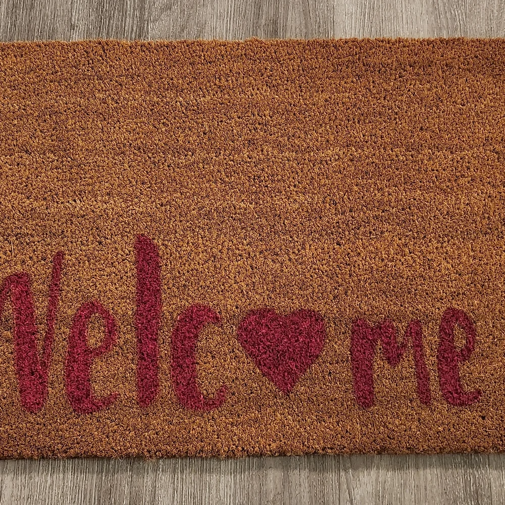 Brown Welcome Mat with Red Accents